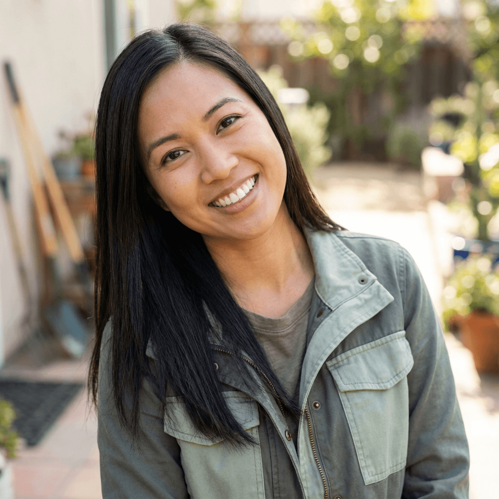 Margaret Chen in her kitchen holding a modern kitchen organizer